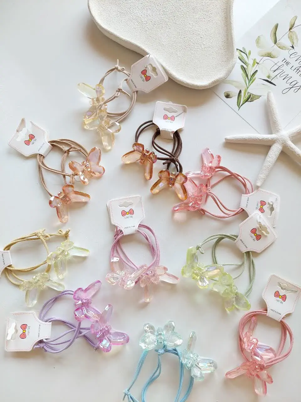 Pack of 2 glass flower hair ties (5) پک دوتایی کش مو پروانه کریستالی - Image 1